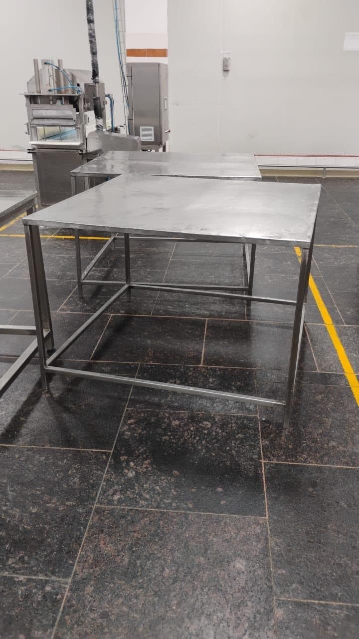 Stainless steel working tables on a Heritage production floor