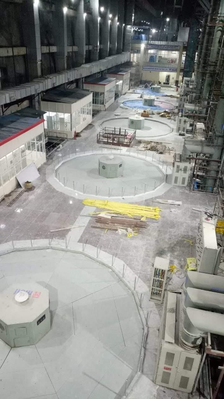 Pump house floor with stainless steel railings around each pump unit