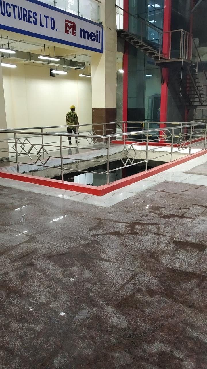 Stainless steel railing with diamond infill around a floor opening