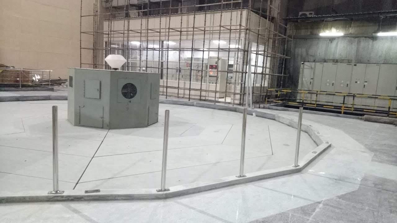 Polished stainless steel posts around a pump unit