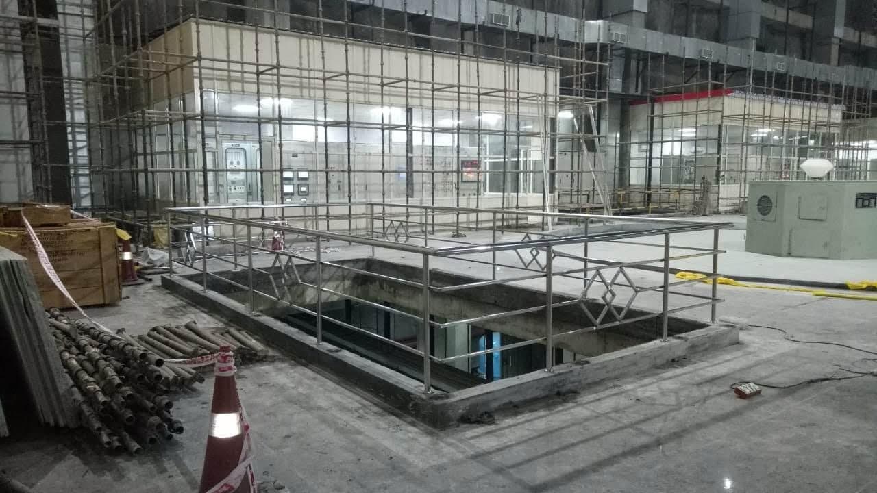 Railing fitted around an opening while the pump house was still under scaffolding